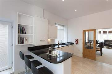 The granite topped breakfast bar.