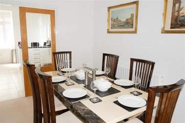 The dining-area and spacious kitchen beyond.