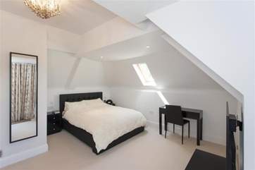 The master bedroom has its own private balcony.