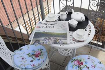 The balcony overlooks the grounds.