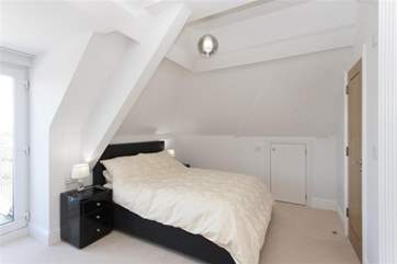 The second double bedroom also has an en suite shower room and private balcony.