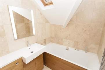 In addition to the two en suite shower rooms there is a family bathroom.