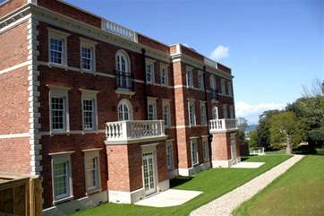 The building is set back from the road in its own grounds.