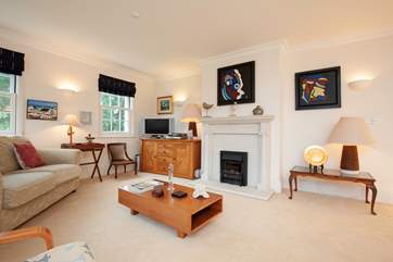 Artwork and antiques make for a beautifully appointed room.