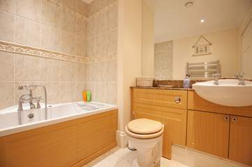 The family bathroom is modern and spacious.