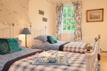 With a seaside theme, the twin room is spacious and comfortable.