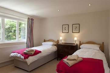 The bright twin bedroom with en suite bathroom.