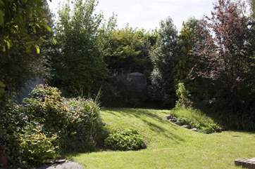 On several levels to the rear of the property, the landscaped garden is a leafy private oasis.
