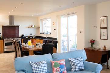 Spacious and bright, the main sitting area is ideal for family time together.