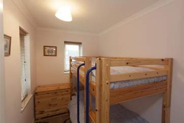 Small bedroom with bunk-beds.