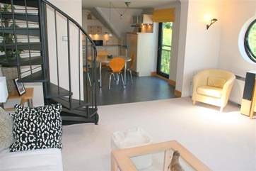 The living room into the kitchen area beyond.