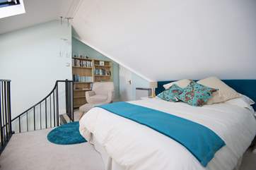A spiral staircase from the living-area leads to the mezzanine, perfect for some quiet time. Please note this bed is not included in the let