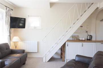 The downstairs sitting-room has a cosy feel.
