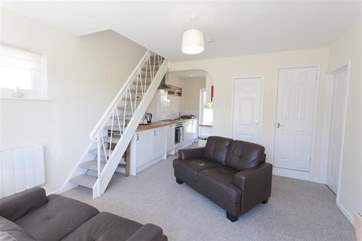 The ground floor also has a double and twin room, located off the cosy living area.