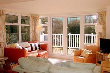 3 Astra House boasts a lovely light, sunny living room with doors out to a decked balcony