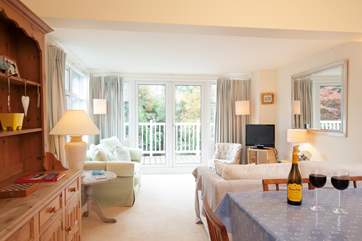 The living room is open plan, and the dining-area is a lovely sunny spot for meal times