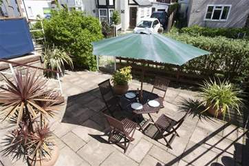 Pretty little patio below the balcony, a real sun trap for enjoying family meals