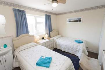 The twin bedroom, also on the second floor, has its own vanity wash basin