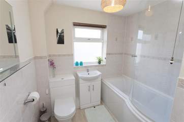 The family bathroom is on the second floor with a shower over the bath