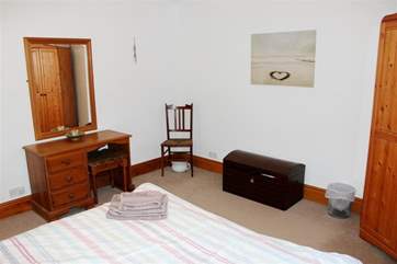 This is a spacious, well-appointed bedroom.