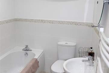 There is a bright family bathroom.