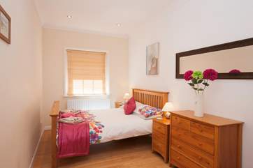 For a good night's sleep, the second bedroom is a delightful space with a comfortable double bed