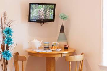 In the master bedroom there is a small TV, bar stools and table to enjoy your morning coffee and read your daily newspaper