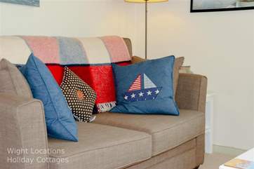 Comfortable seating with a cosy blanket to snuggle under while watching TV.