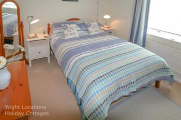 The soft lighting enhances the cosy feel of this room when the curtains are closed.