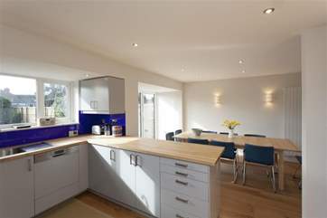 Kitchen and dining-area with doors onto the patio and garden