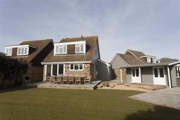 The garden has been thoughtfully landscaped to provide a wonderful outdoor dining-area