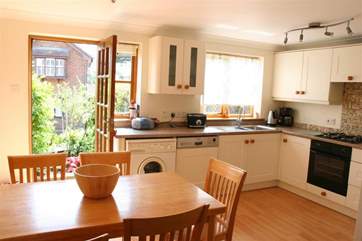 Kitchen/dining room that opens up to a courtyard garden