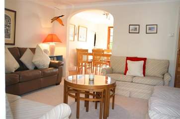 Living area with archway to kitchen