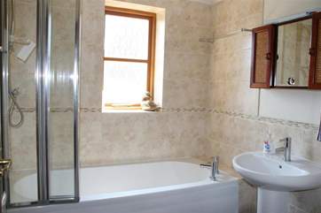 Family bathroom with shower over bath