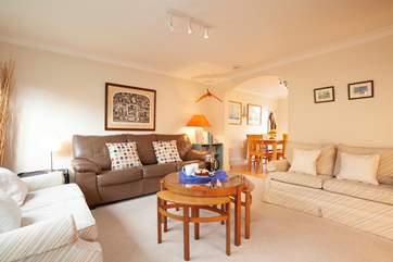 The sitting room leads on to a modern kitchen and dining area.