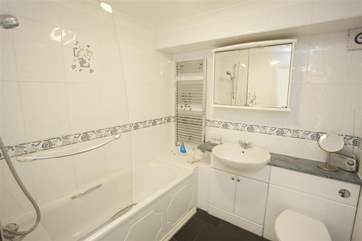 Family bathroom with shower over the bath