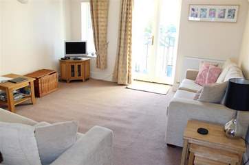 Double doors open out from the living room offering a lovely breeze on those warm summer evenings.