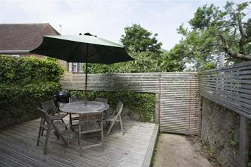 Raised decking area in the enclosed rear garden