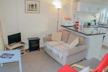 The compact kitchen and living area