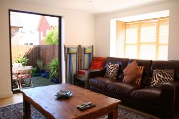 The open plan living, dining-room and kitchen open up to a fully enclosed patio