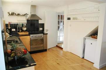 The kitchen is both modern and fully equipped
