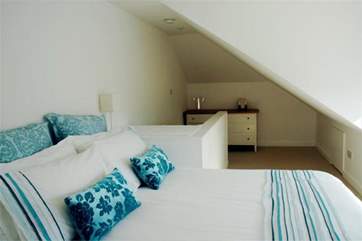 The main bedroom is in the eaves on the second floor; lovely, sunny and spacious