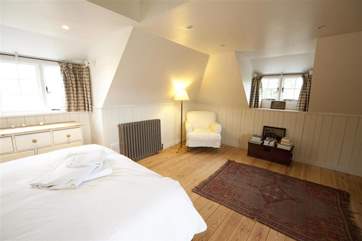 The bedroom is lovely and large with views across the garden