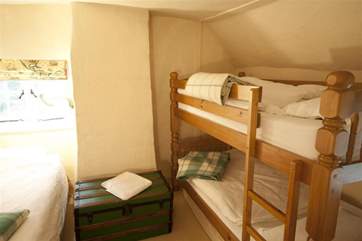 Family bedroom with bunk beds and a day bed