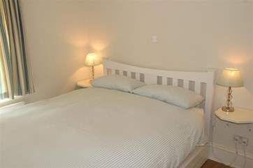 The king-size downstairs bedroom which has its own little cloakroom