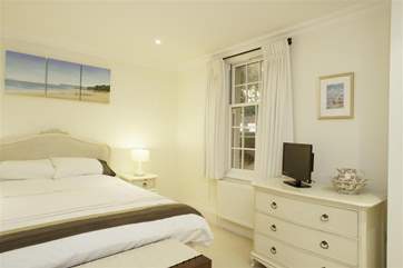 The master bedroom overlooks the parking-area with its relaxing water feature