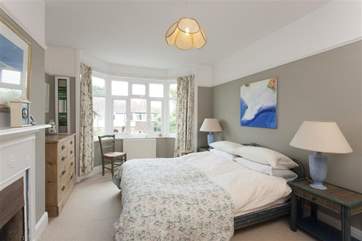 The master bedroom overlooks Fairy Road and has a lovely feature fireplace