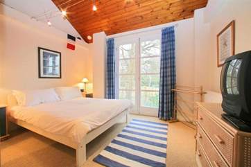 King size bedroom on the first floor with views towards the creek