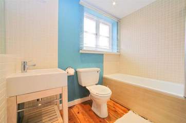 Family bathroom with shower over bath on the first floor
