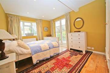 The double bedroom looks out to the side of Creekside with slight views of the creek and with connecting landings to the other bedrooms on the same floor